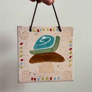 Urban Outfitters Ceramic Wall Hanging with Snail and Mushroom Design
